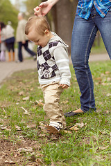 Image showing Baby Learning to Walk in Park