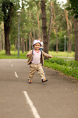 Image showing Baby Learning to Walk in Park