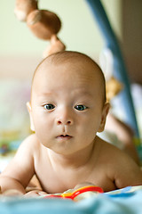 Image showing Baby Boy or Girl lying Down in the Bed