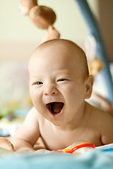 Image showing Baby Boy or Girl lying Down in the Bed