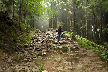 Image showing Mother and son in the mystic green foggy forest