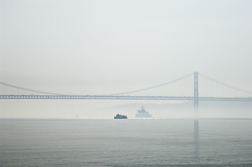 Image showing Ferrys crossing the Tagus river in a foggy morning