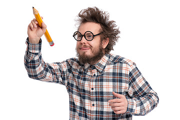 Image showing Crazy bearded man with big pencil