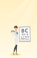 Image showing Professional ophthalmologist holding eyeglasses.