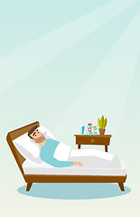 Image showing Sick man with thermometer laying in bed.