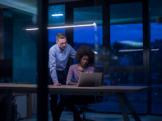 Image showing Multiethnic startup business team in night office