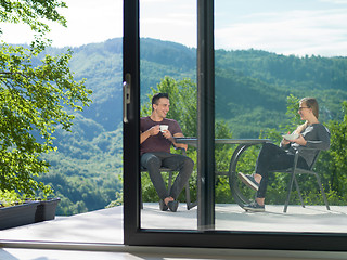 Image showing couple enjoying morning coffee and breakfast