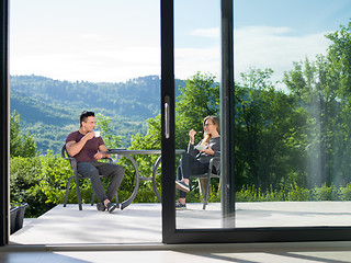 Image showing couple enjoying morning coffee and breakfast