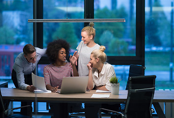 Image showing Multiethnic startup business team in night office