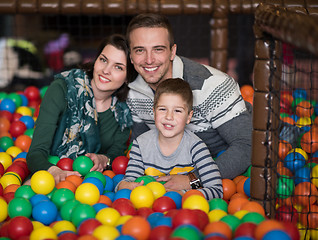 Image showing young parents with kids in a children\'s playroom