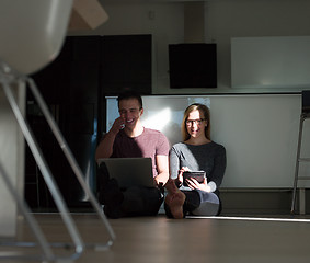 Image showing couple using tablet and laptop computers