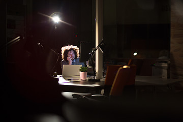 Image showing businessman relaxing at the desk