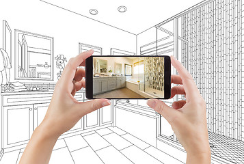 Image showing Hands Holding Smart Phone with Master Bathroom Photo on Screen a