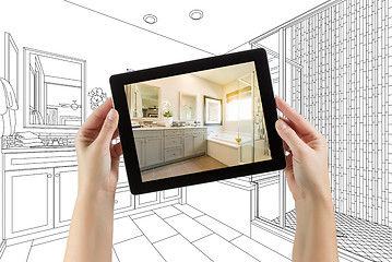 Image showing Hands Holding Computer Tablet with Master Bathroom Photo on Scre