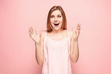 Image showing Beautiful woman looking suprised isolated on pink