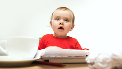 Image showing Happy child baby girl toddler sitting with keyboard of computer isolated on a white background