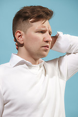 Image showing Beautiful bored man isolated on studio background