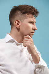 Image showing Beautiful bored man isolated on studio background