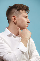 Image showing Beautiful bored man isolated on studio background