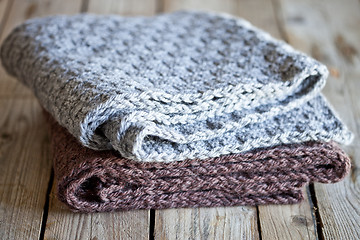 Image showing knitted woolen grey and brown scarves