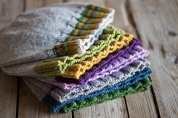 Image showing Multicolor knitted hats stack