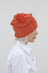 Image showing Pretty young woman in warm orange beanie