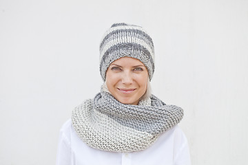 Image showing Young woman in warm grey knitted hat and snood