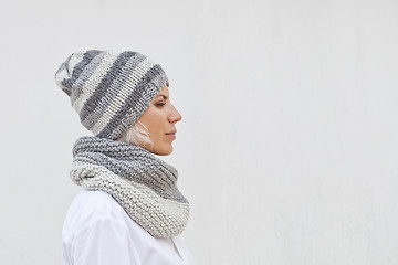 Image showing Young woman in warm grey knitted hat and snood