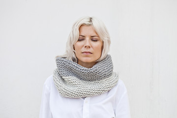 Image showing Pretty young woman in warm grey wool knitted snood