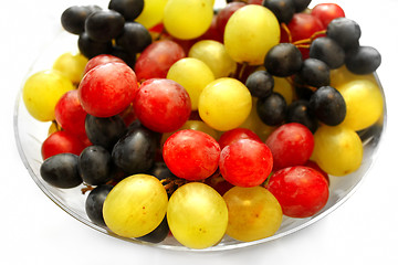 Image showing Bright assortment tasty ripe grapes in a glass plate