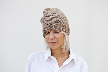 Image showing Pretty young woman in warm brown beanie