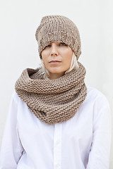 Image showing Woman in warm brown knitted hat and snood