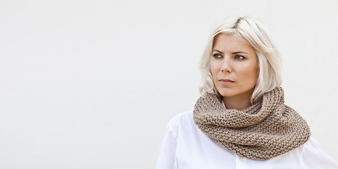 Image showing Woman in warm beige wool knitted snood