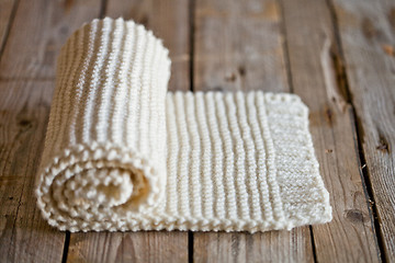 Image showing Hand knitted white scarf