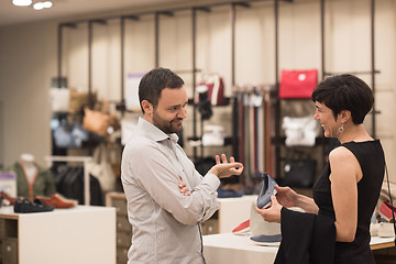 Image showing couple chooses shoes At Shoe Store