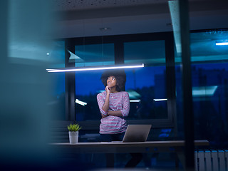 Image showing black businesswoman using a laptop in startup office