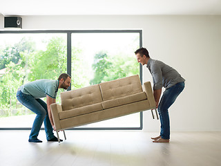 Image showing men carry the sofa