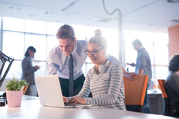 Image showing Two Business People Working With laptop in office