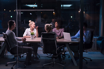 Image showing Multiethnic startup business team in night office