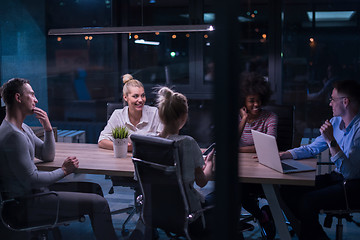 Image showing Multiethnic startup business team in night office