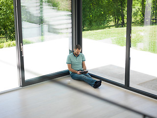 Image showing man on the floor enjoying relaxing lifestyle