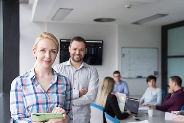 Image showing Business People Working With Tablet in startup office