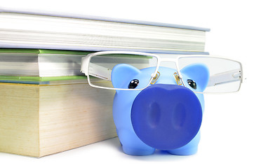 Image showing Piggy bank, glasses and stack of books 