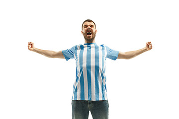 Image showing The Argentinean soccer fan celebrating on white background