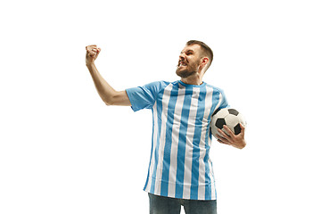 Image showing The Argentinean soccer fan celebrating on white background