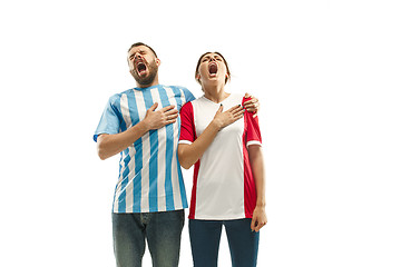 Image showing The Argentinean soccer fan celebrating on white background