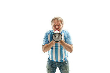 Image showing The Argentinean soccer fan celebrating on white background