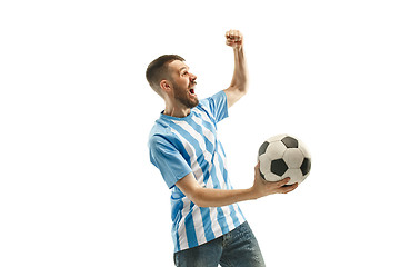 Image showing The Argentinean soccer fan celebrating on white background