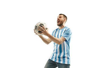 Image showing The Argentinean soccer fan celebrating on white background