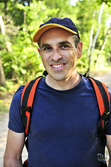 Image showing Man hiking on forest trail